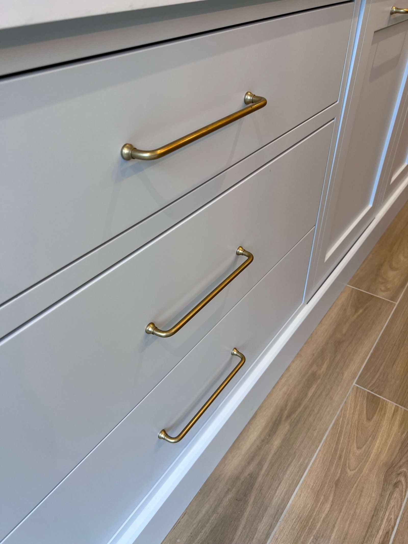 gold-metal-handles-on-cupboard-drawer