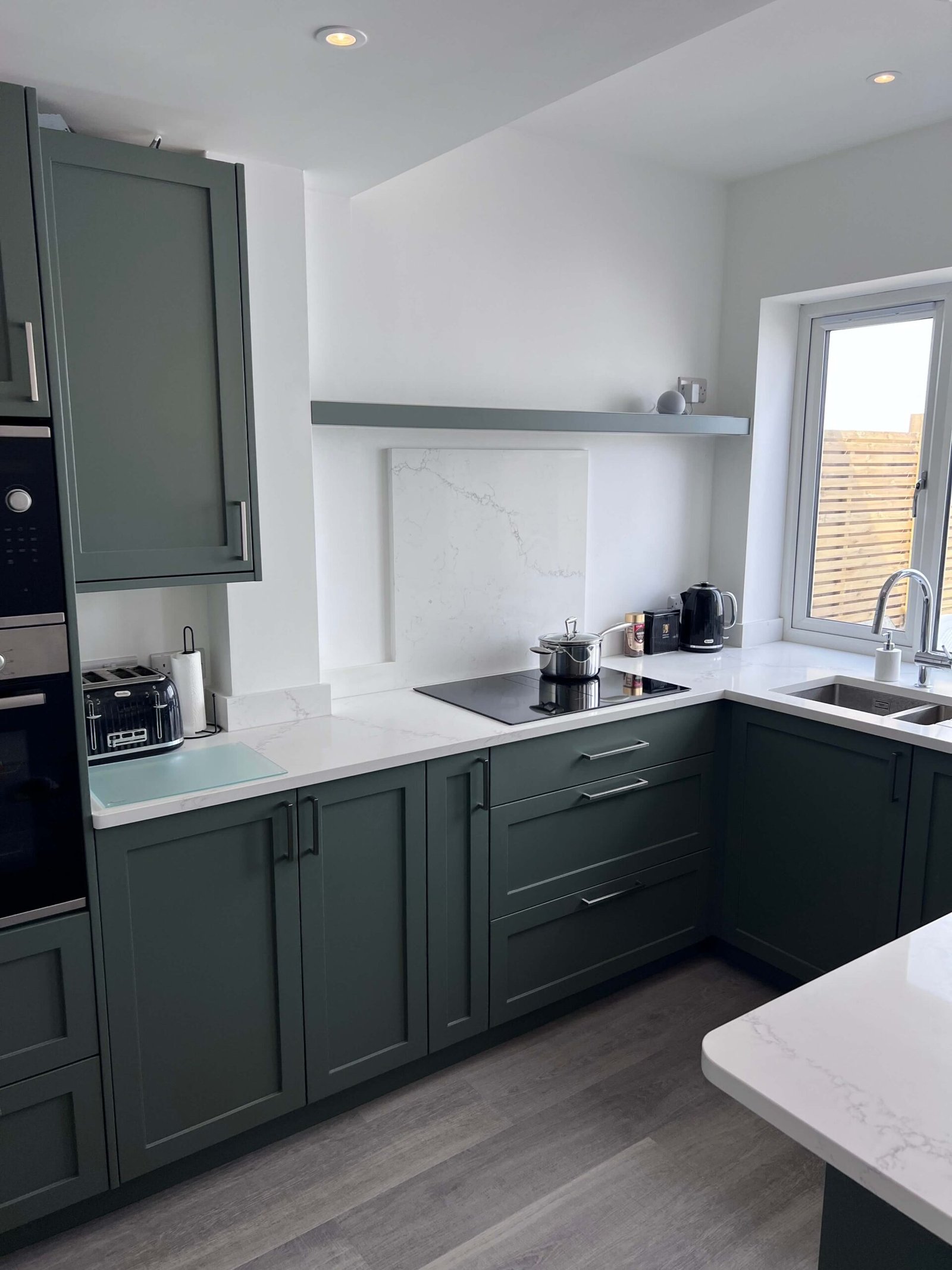 dark-green-kitchen-withwhite-marble-coutnertop